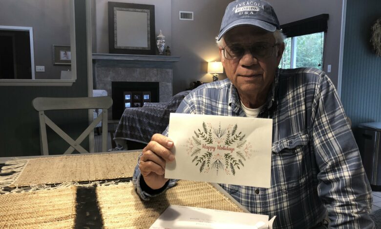 Michael Esmond holding greeting card