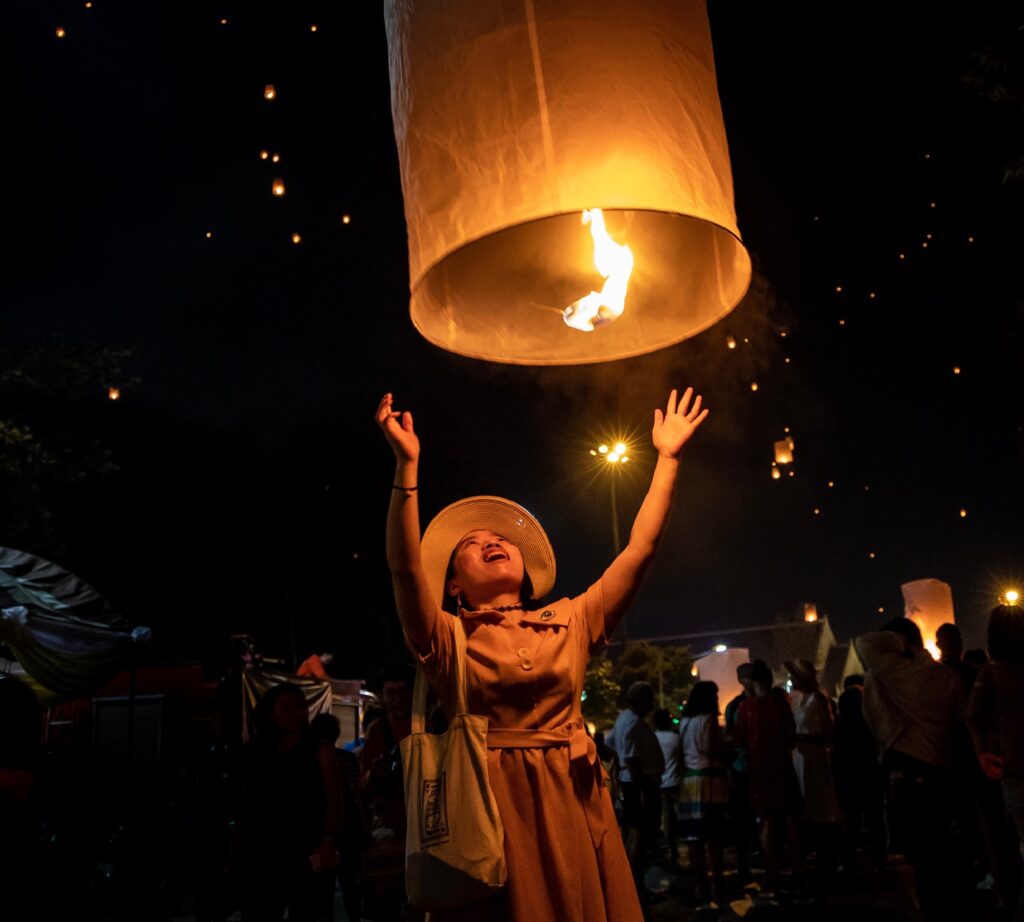 Image of woman release Chinese lantern