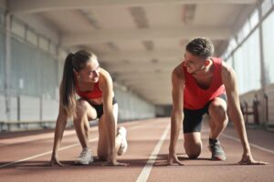 Image of man and woman ready to race