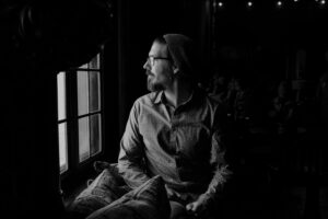 Man sitting inside alone