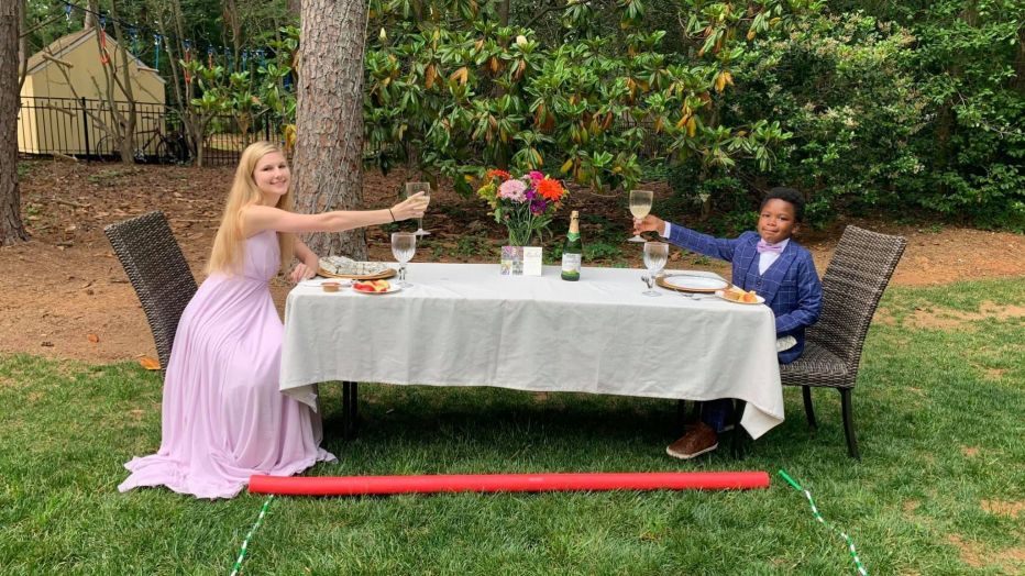 Image of 7-year-old boy hosting dinner for his teenage nanny