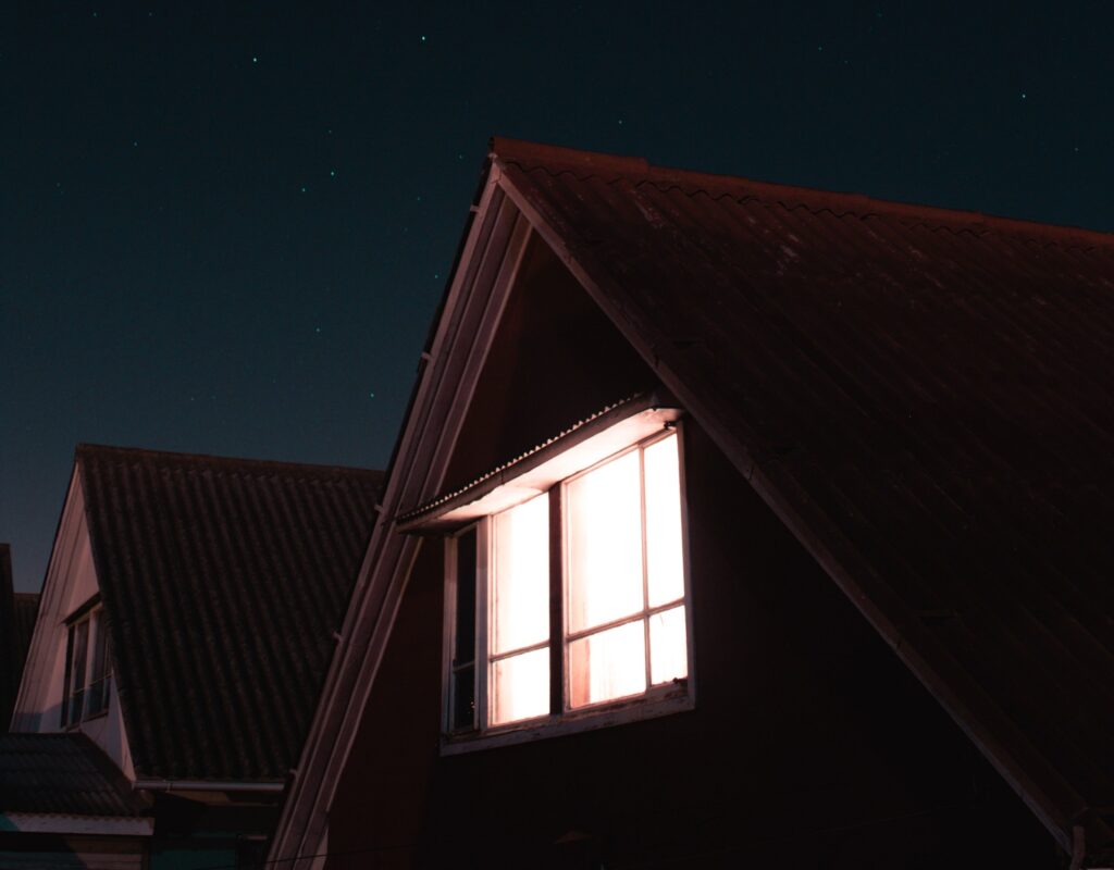 Image of a home illuminated at night