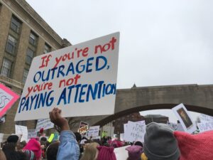 Image of protester holding sign