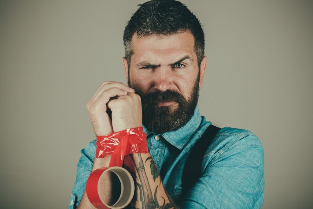 Picture of man's hands wrapped in red tape