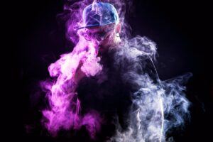 Picutre of man disappearing behind cloud of smoke