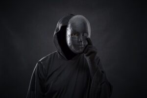 Image of evil removing a mask