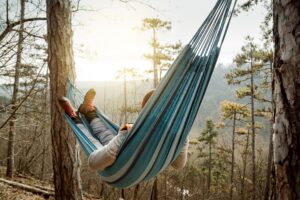Image of a man resting in a hammock