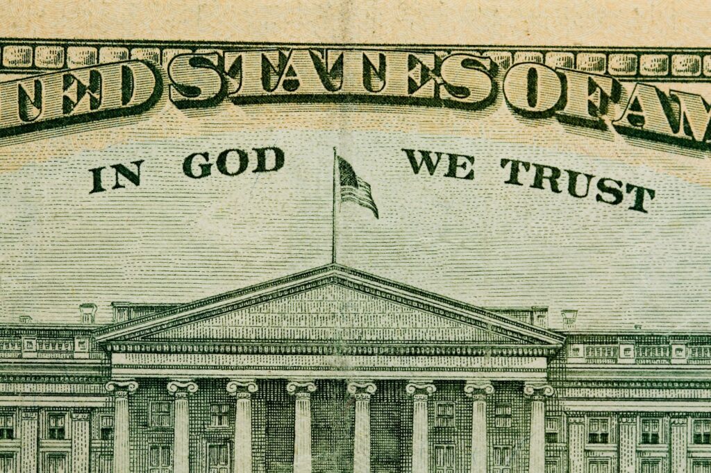 Paper money with words In God We Trust