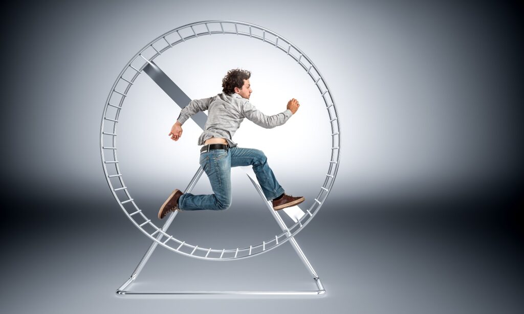 Image of a man caught in a hamster wheel