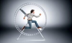 Image of a man caught in a hamster wheel