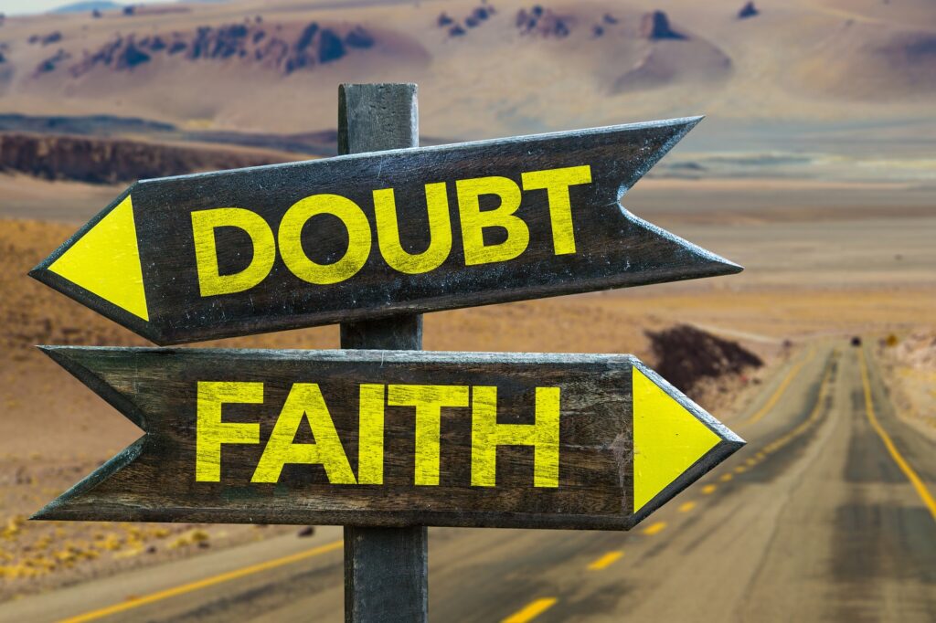 Image of directional signs pointing to faith and doubt