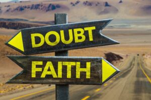 Image of directional signs pointing to faith and doubt
