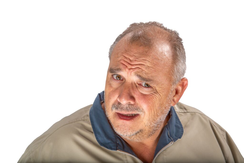 Image of a skeptical older man